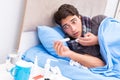 The sick man with flu lying in the bed Royalty Free Stock Photo