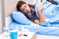 The sick man with flu lying in the bed Royalty Free Stock Photo