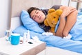 The sick man with flu lying in the bed Royalty Free Stock Photo