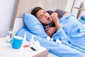 The sick man with flu lying in the bed Royalty Free Stock Photo