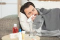 sick man with flu lying in sofa at home Royalty Free Stock Photo