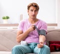 Sick man at home with first aid kit Royalty Free Stock Photo