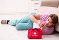 Sick man at home with first aid kit Royalty Free Stock Photo