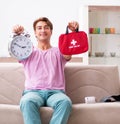 Sick man at home with first aid kit Royalty Free Stock Photo