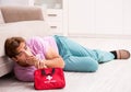 Sick man at home with first aid kit Royalty Free Stock Photo