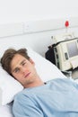 Sick man lying in hospital bed Royalty Free Stock Photo