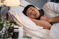 Sick man sleeping in bed Royalty Free Stock Photo