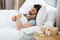 sick man sleeping in bed at home Royalty Free Stock Photo