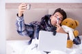 The sick man suffering from flu in the bed Royalty Free Stock Photo