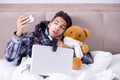 The sick man suffering from flu in the bed Royalty Free Stock Photo