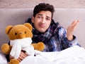 Sick man suffering from flu in the bed Royalty Free Stock Photo