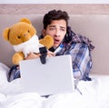 Sick man suffering from flu in the bed Royalty Free Stock Photo