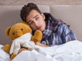 The sick man suffering from flu in the bed Royalty Free Stock Photo