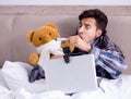 Sick man suffering from flu in the bed Royalty Free Stock Photo