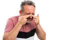 Sick man wearing tshirt touching nose as sinuses pain concept Royalty Free Stock Photo