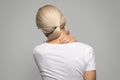 Sick mature blond woman suffering acute neck pain Royalty Free Stock Photo