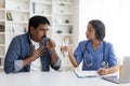 Sick Mature Indian Man Coughing During Meeting With Female Doctor In Clinic Royalty Free Stock Photo