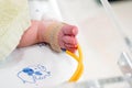 Sick newborn baby foot Insert a strap to measure oxygen in the blood and see the oxygen value for organs