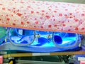 Sick newborn baby sleeping in phototherapy unit box for treatment neonatal hyperbilirubinemia and neonatal jaundice in NICU wards