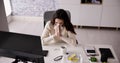 Sick Office Employee Sneezing At Work