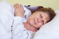 Sick old lady in bed Royalty Free Stock Photo