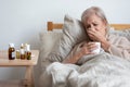 Sick old woman suffer from illness at home alone