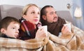 Sick parents and son under blanket Royalty Free Stock Photo