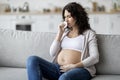 Sick Pregnant Woman Suffering Cold Or Flu While Sitting At Home Royalty Free Stock Photo