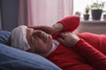 A sick male sleeping with wet towel on his forehead to reduce high high fever Royalty Free Stock Photo