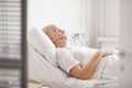 Sick Senior Man in Hospital Bed Royalty Free Stock Photo