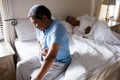 Sick senior man suffering from stomach ache in bedroom Royalty Free Stock Photo
