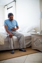 Sick senior man suffering from stomach ache in bedroom Royalty Free Stock Photo