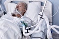 Sick Senior Patient Rests on Bed, Man Sleeping in Modern Hospital Ward. Royalty Free Stock Photo