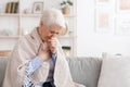 Sick Senior Woman Covered In Blanket Coughing Hard At Home