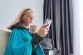 Sick teenager sneezing in handkerchief makes video call to doctor Royalty Free Stock Photo