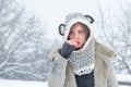 Sick in winter. Cold flu winter season, runny nose. Showing sick woman sneezing at winter park. Young woman blowing nose
