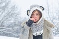 Sick in winter. Cold flu winter season, runny nose. Showing sick woman sneezing at winter park. Young woman blowing nose Royalty Free Stock Photo