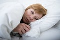 sick woman in bed with thermometer feverish weak suffering cold winter flu virus Royalty Free Stock Photo