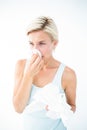 Sick woman blowing her nose Royalty Free Stock Photo