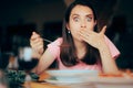 Sick Woman Eating Soup in a Restaurant Feeling Nauseated Royalty Free Stock Photo