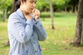 Sick woman feeling bad suffering from sore throat,painful swallowing,asian female patient have coughing,irritation and sore throat Royalty Free Stock Photo