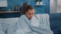 Sick woman feeling cold and having chills because of illness