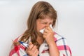 Sick woman with flu or cold sneezing into handkerchief Royalty Free Stock Photo