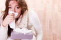 Sick woman girl with fever sneezing in tissue