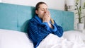 Portrait of sick woman got flu lying in bed and coughing Royalty Free Stock Photo