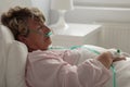 Sick woman with nasal cannula Royalty Free Stock Photo