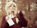 Sick woman sneezing in tissue outdoor Royalty Free Stock Photo