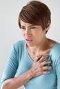 Sick woman with sudden heart attack Royalty Free Stock Photo