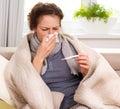 Sick Woman with Thermometer