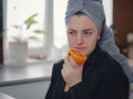 Sick woman trying to sense smell of fresh orange Royalty Free Stock Photo